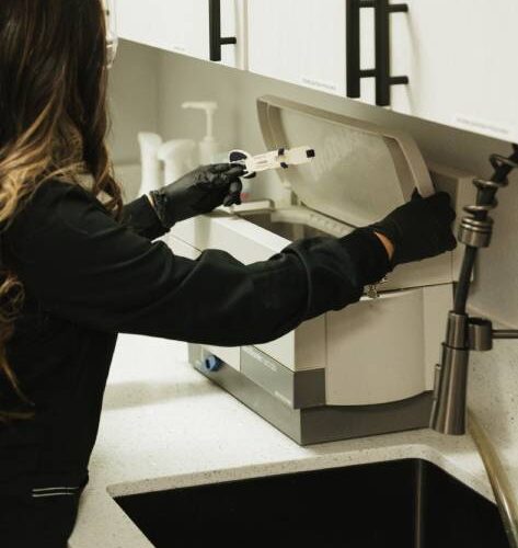 Dental Assistant preparing the lab result Dental Assistant preparing the lab result